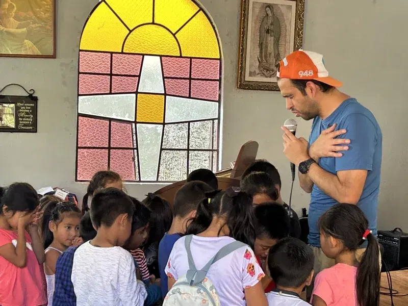 Praying with the children in the chapel