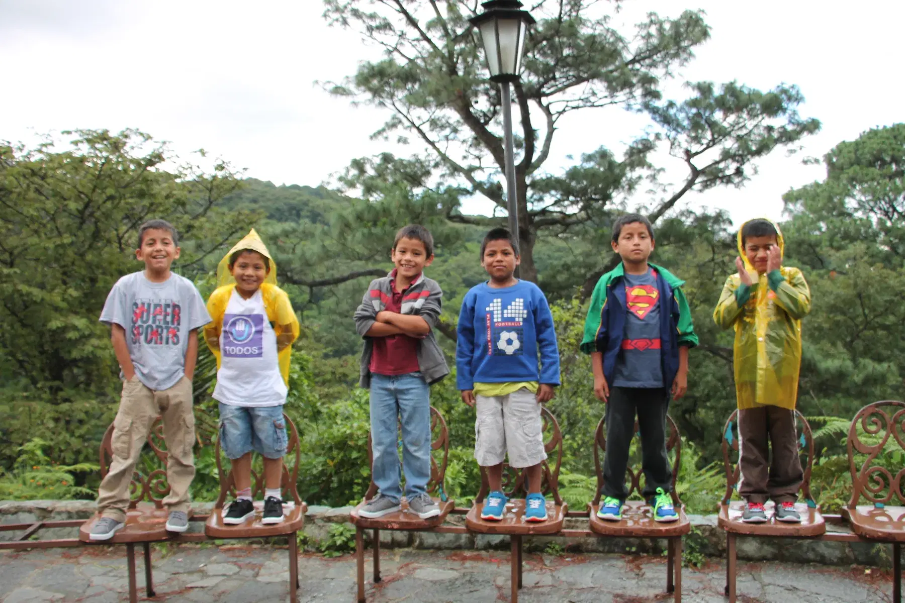 Children in Aguacate lined up in their new shoes