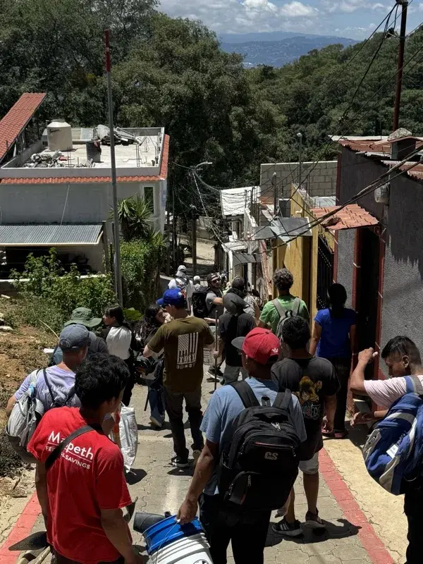 Carrying supplies down into the village of Aguacate